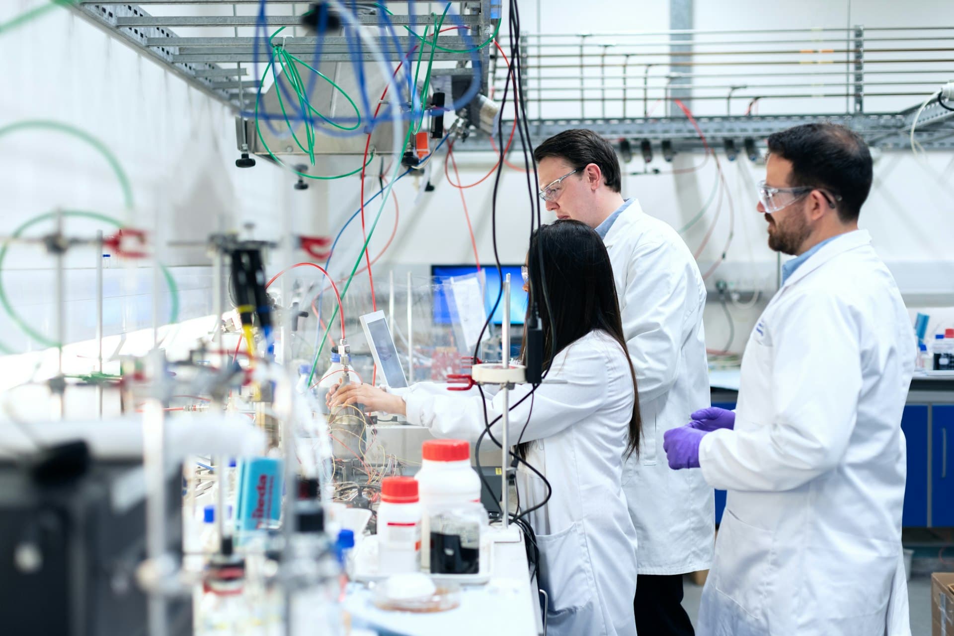 Laboratory research team reviewing samples